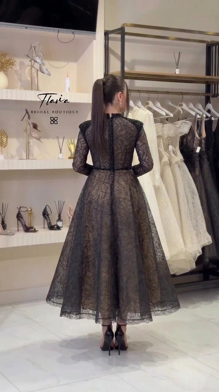 Back view of black high neck lace midi evening dress