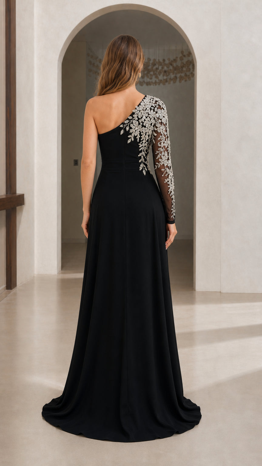 Back view of black one-shoulder maxi dress showing draped chiffon skirt