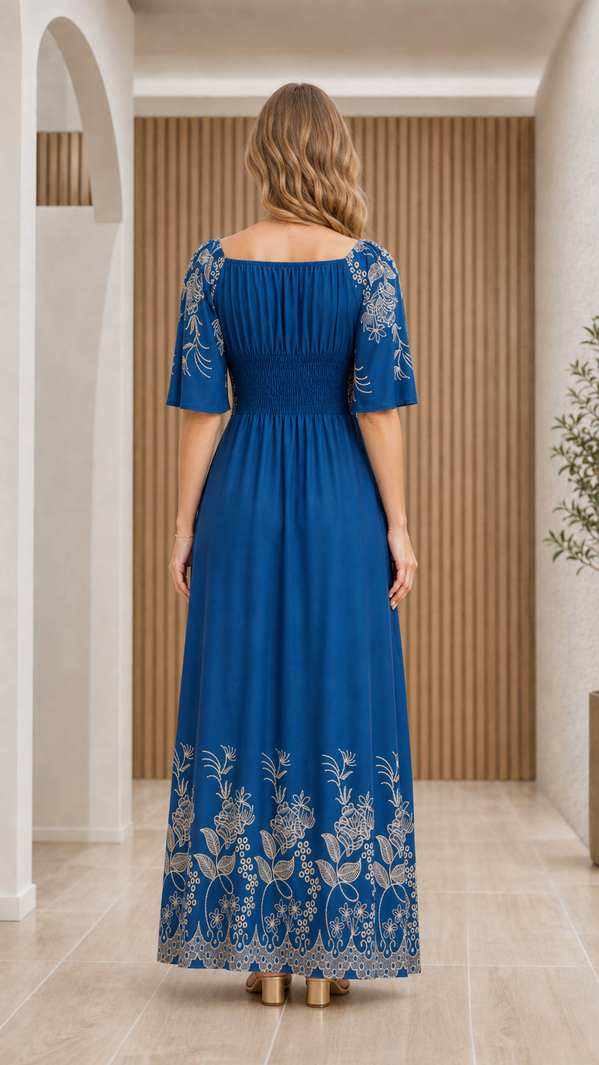 Back full-length view of Royal Blue floral embroidered maxi dress showing smocked back bodice