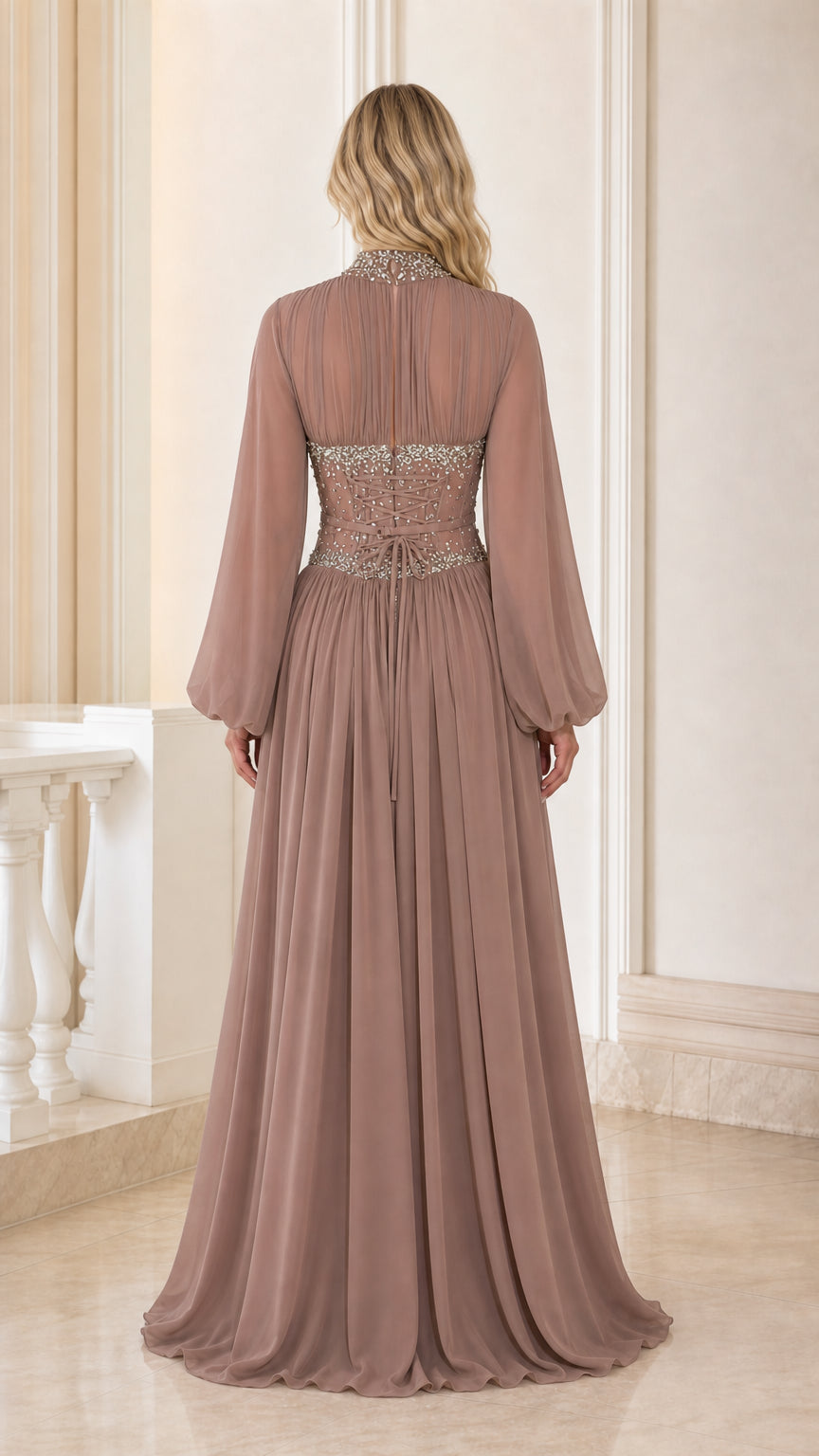 Back view of dusty mauve formal evening gown showing embellished waist detail and floor-length skirt