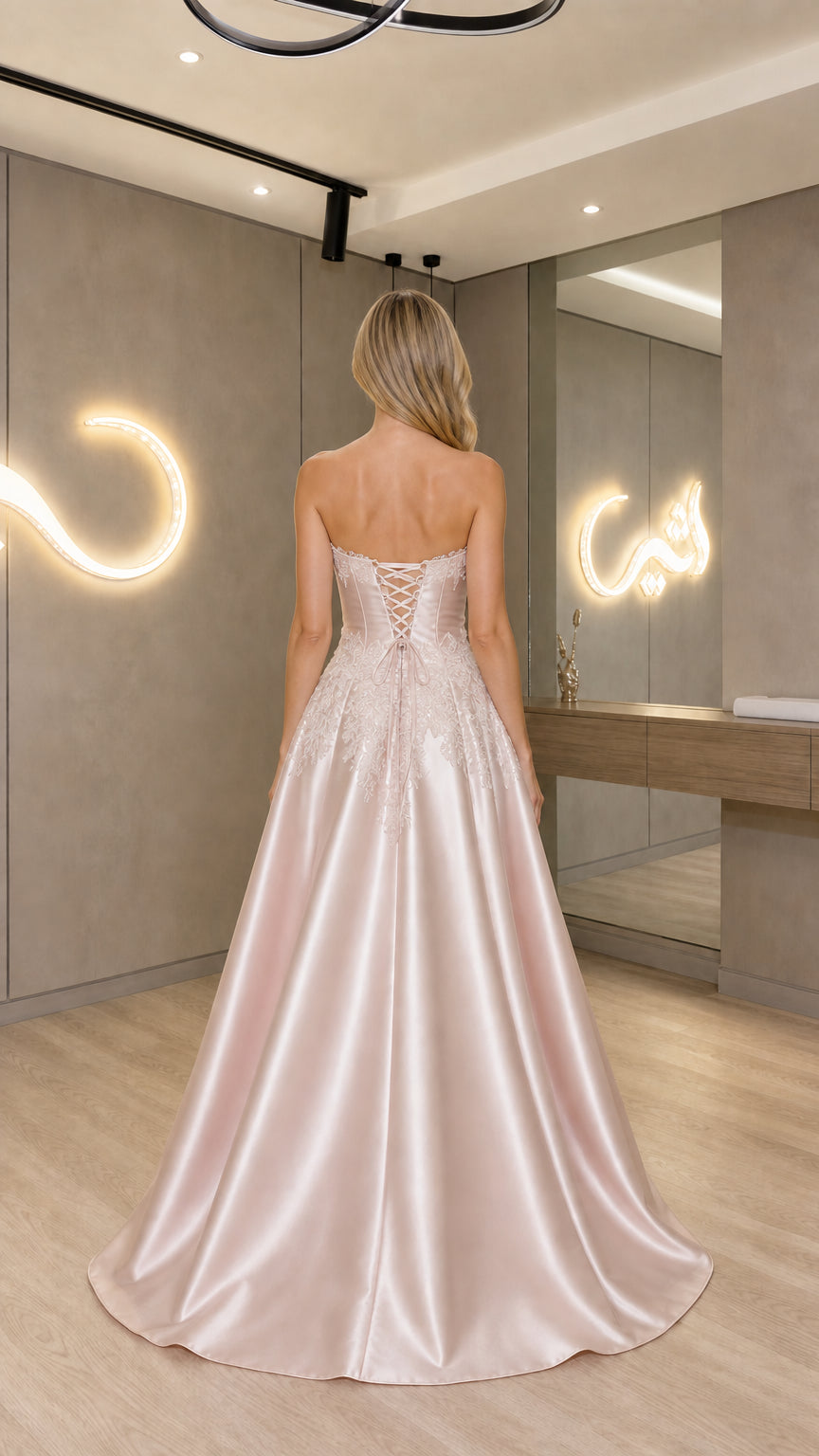 Back view of Blush Pink gown showcasing corset lace-up back detail