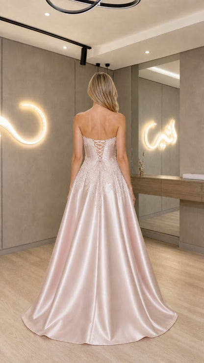 Back view of Blush Pink gown showcasing corset lace-up back detail
