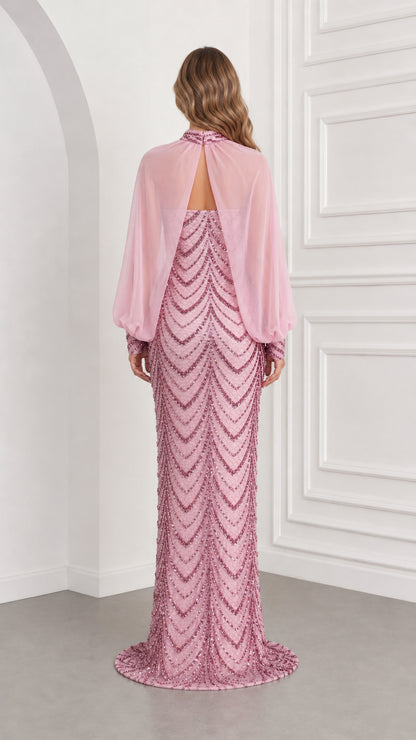 Back view of pink sequin evening gown showing draped chiffon capelet and back neckline