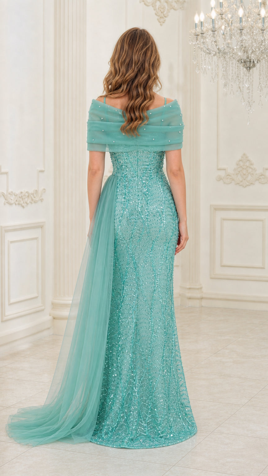 Back view of aqua green sequin evening gown showing flowing tulle train