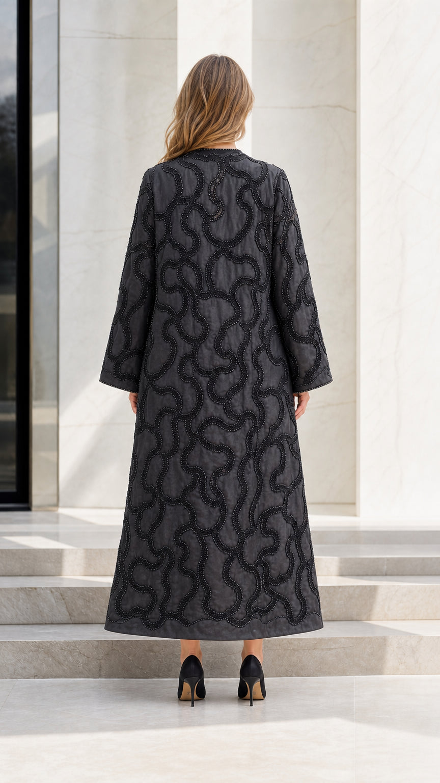 Model wearing Black embroidered maxi cardigan back view