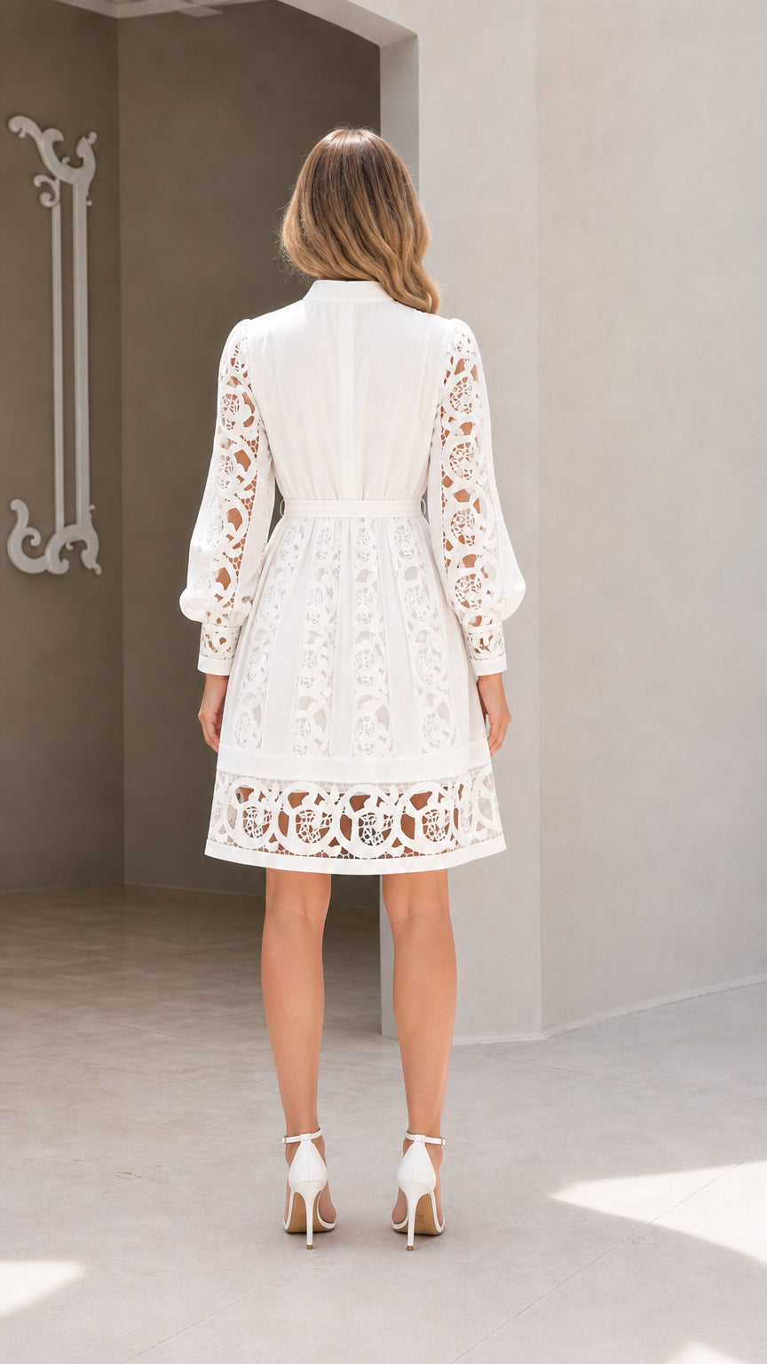 Model wearing white lace long sleeve dress back view