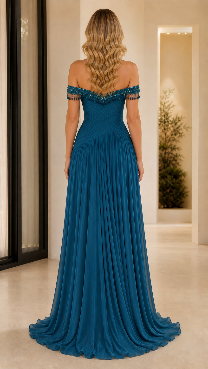 Back view of teal blue pleated chiffon evening dress with sweeping floor length skirt