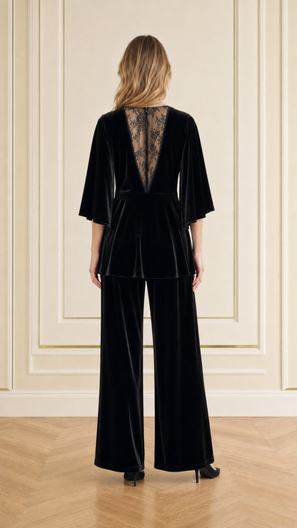 Back view showing sheer lace V-back detail on black velvet evening set