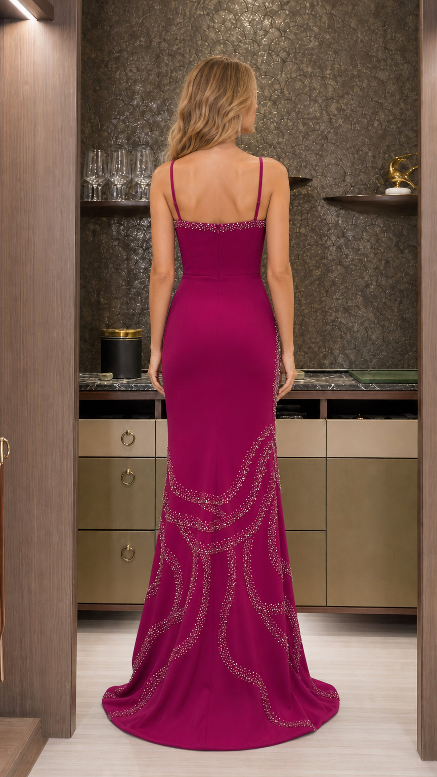 Back view of the magenta formal mermaid gown showing slender straps and fitted silhouette
