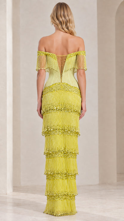 Back view of lime green fringe maxi gown showing corset lace-up closure