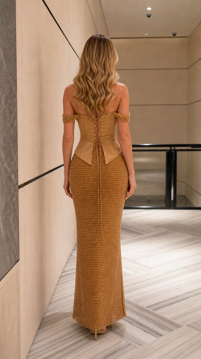 Back view of gold evening gown showing adjustable lace-up corset closure