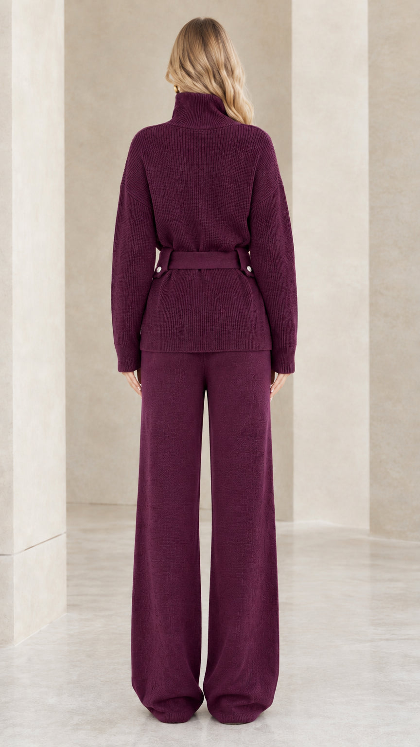 Back view of woman showing the clean drape of the plum ribbed knit two-piece lounge set