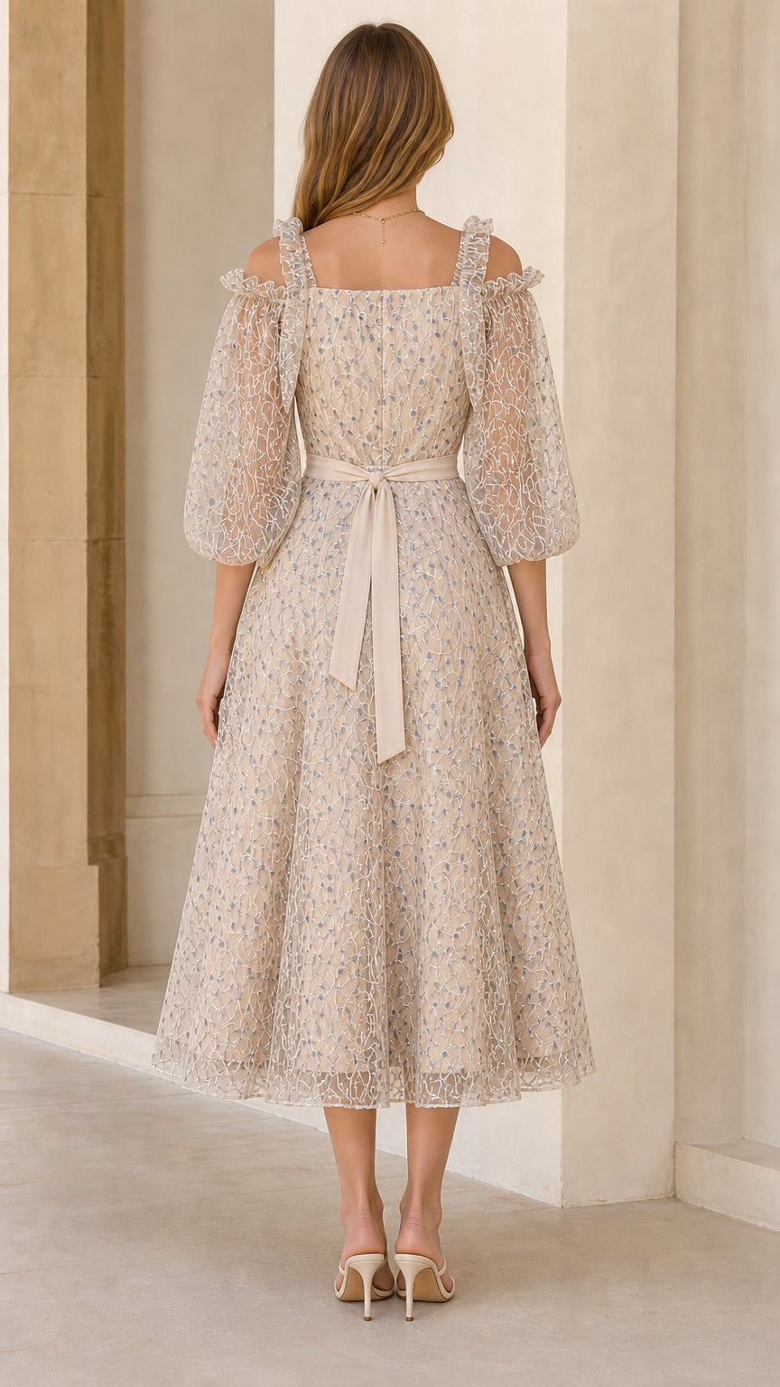 Back view of champagne lace midi dress showing self-tie sash