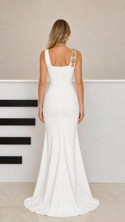 Back view of model wearing white mermaid evening gown showing square back and sleek fit