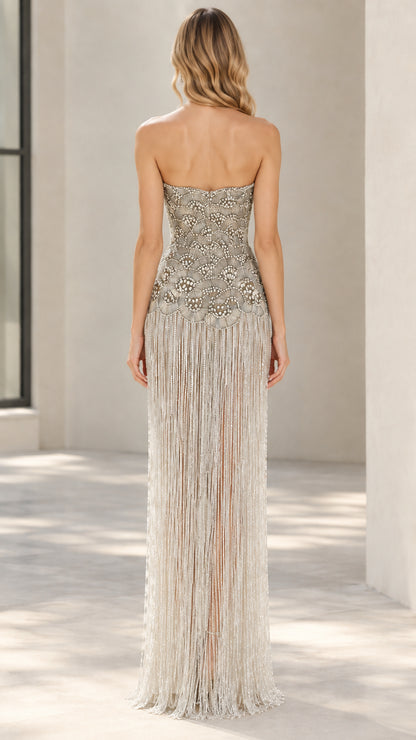 Back view of Champagne strapless beaded gown with flowing fringe
