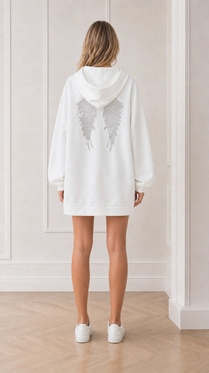 Back view of model showing lace angel wings on white hoodie dress