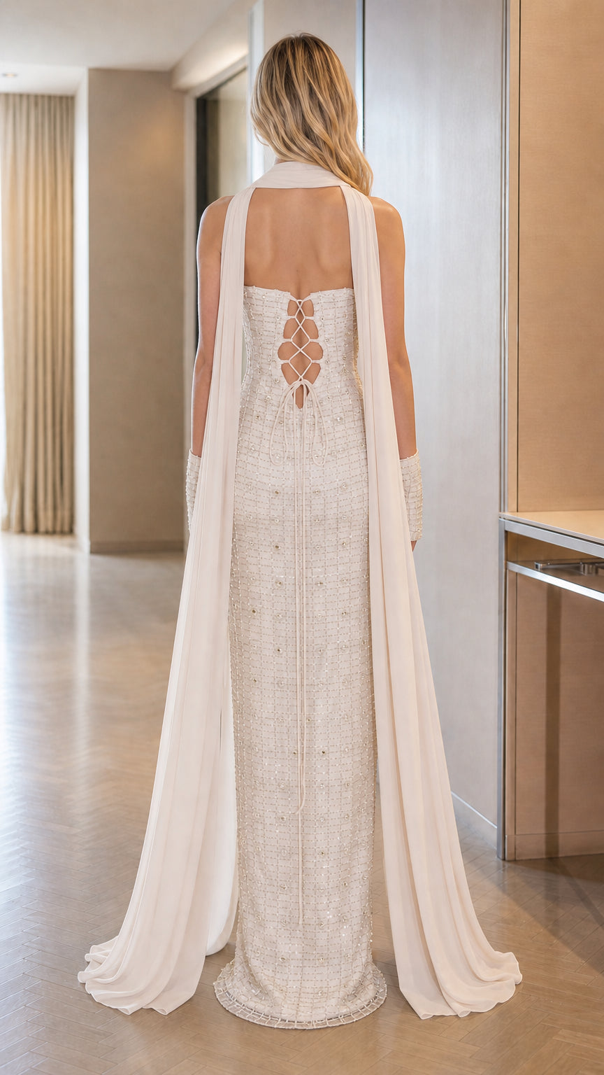 Back view of the Ivory White evening gown showcasing the corset lace-up closure and sweeping chiffon train