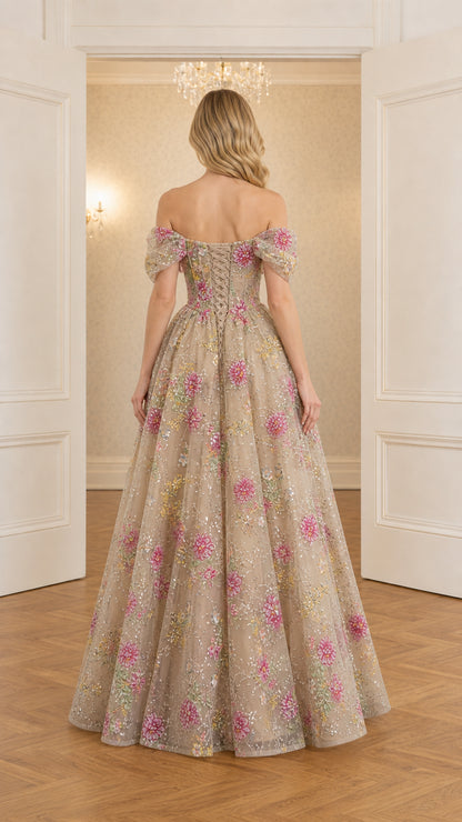 Back view of model wearing champagne floral embroidered ball gown with off-shoulder sleeves
