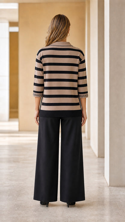 Back view of woman wearing Camel striped knit polo sweater with black trousers