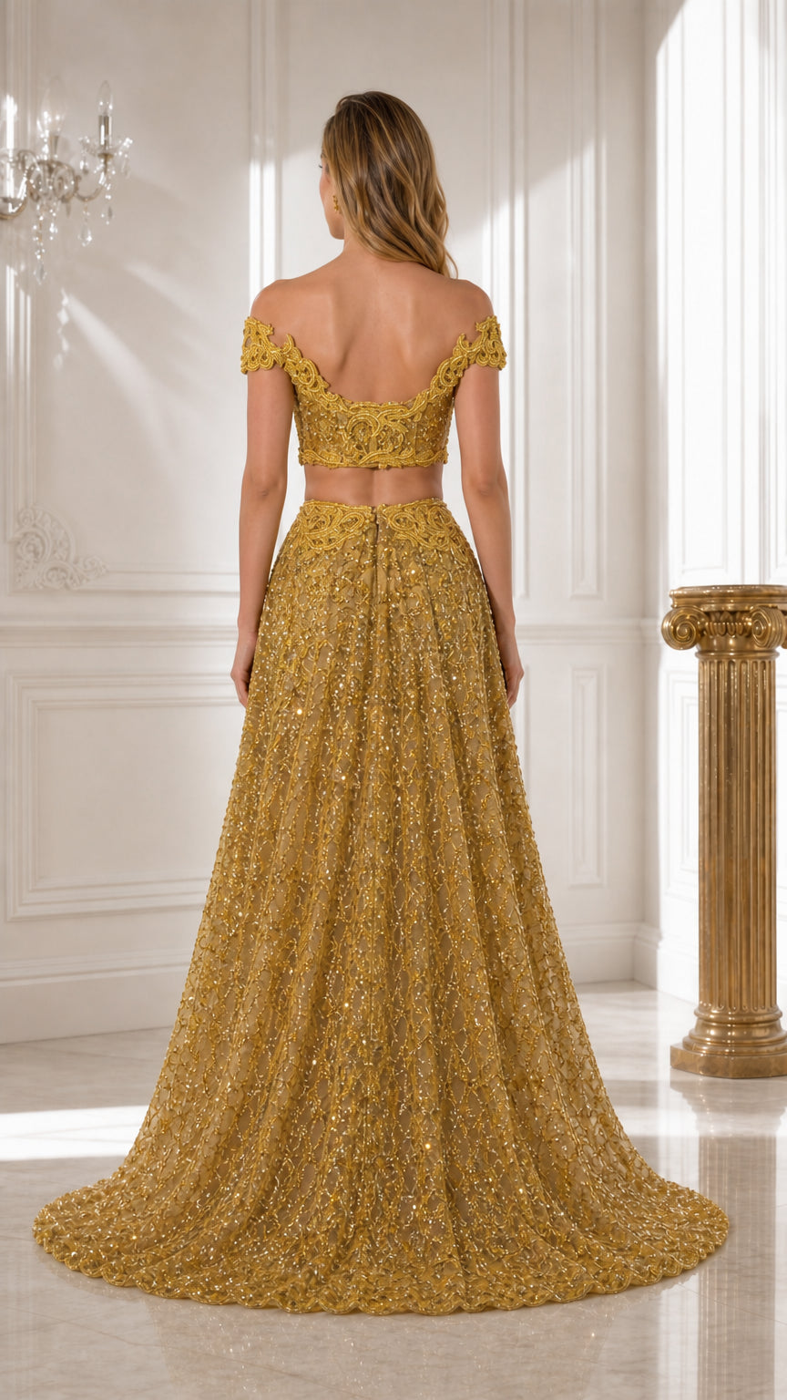Back view of gold off-shoulder crop top and sweeping beaded A-line skirt