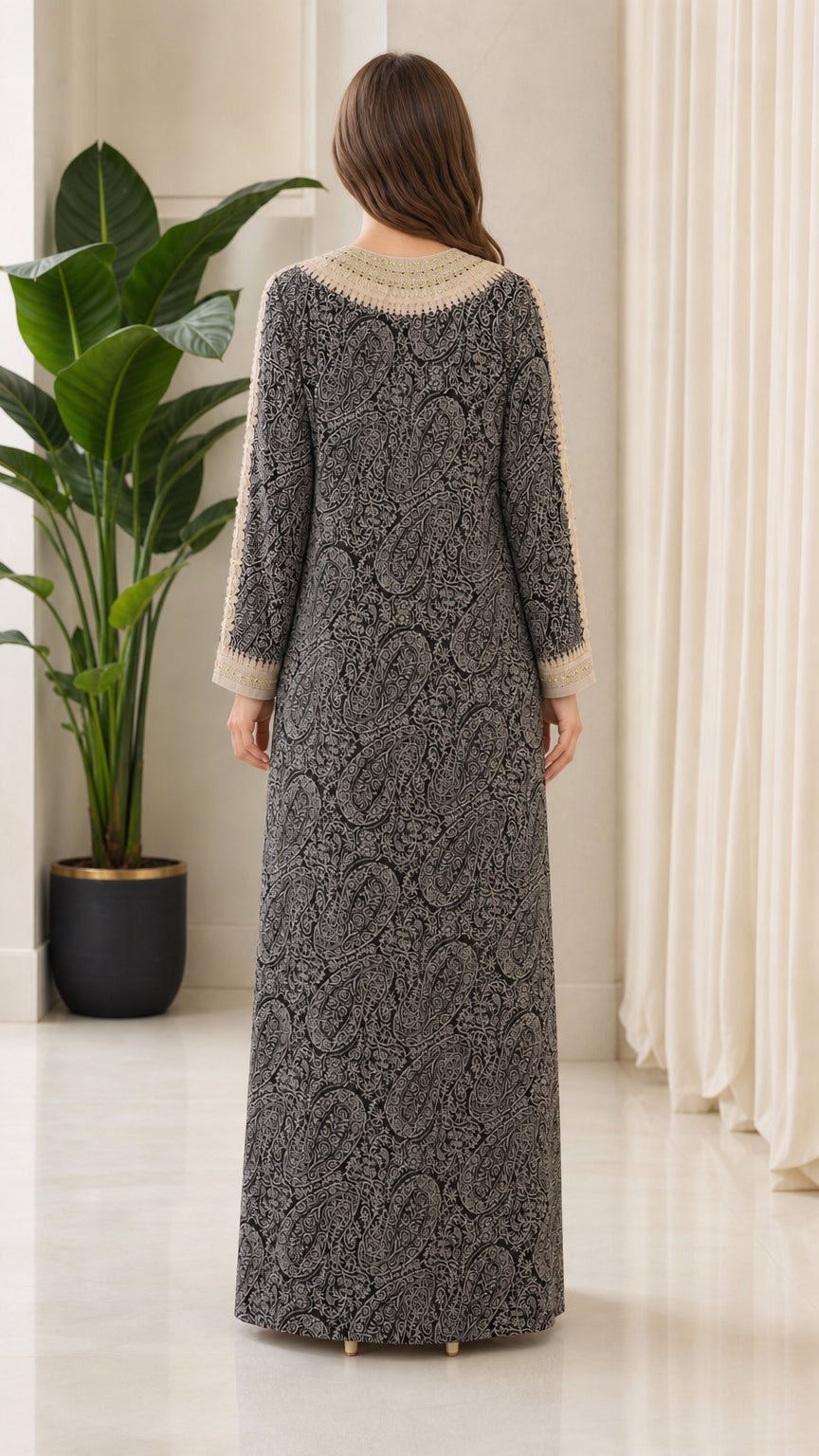 Back view of model wearing black all-over pattern kaftan dress