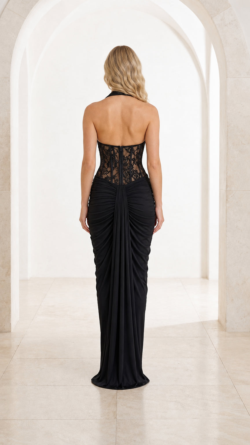 Back view of black halter open back draped maxi dress