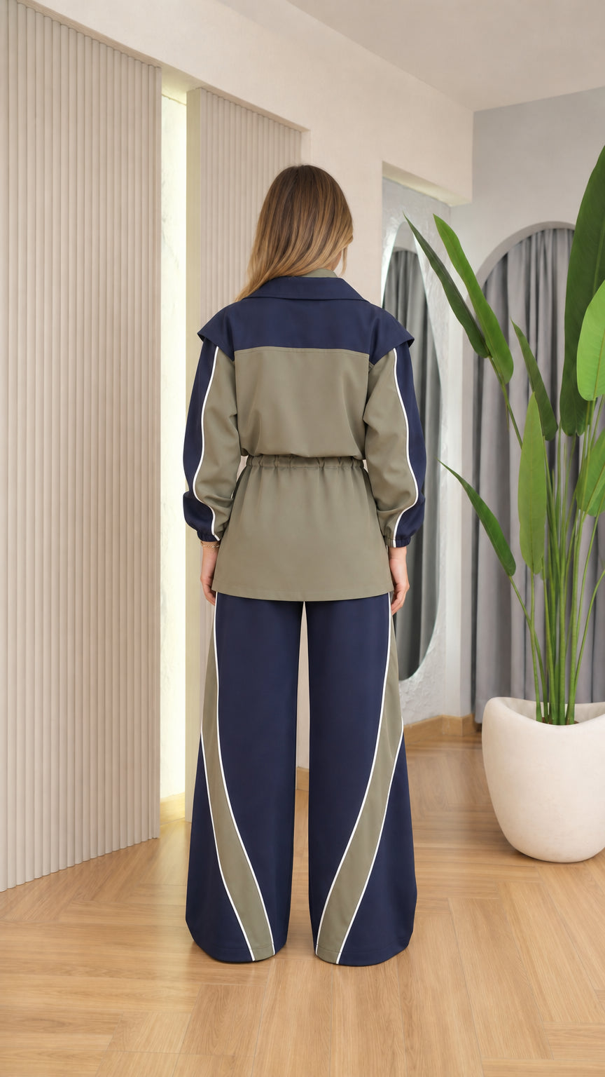 Back view of navy and olive colorblock jacket and wide leg pants matching set