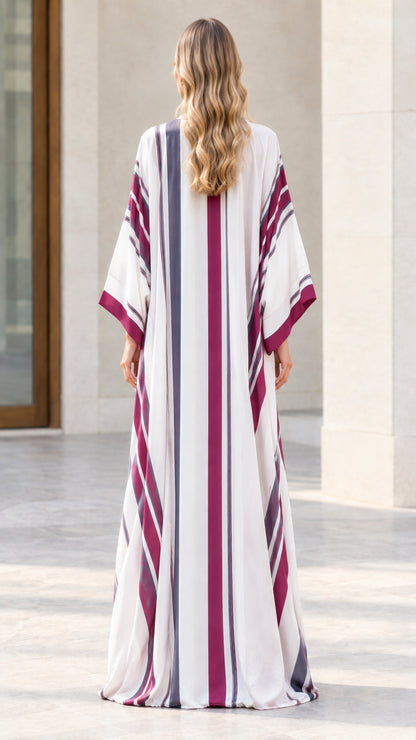 Back view of woman wearing full-length off-white striped kimono duster
