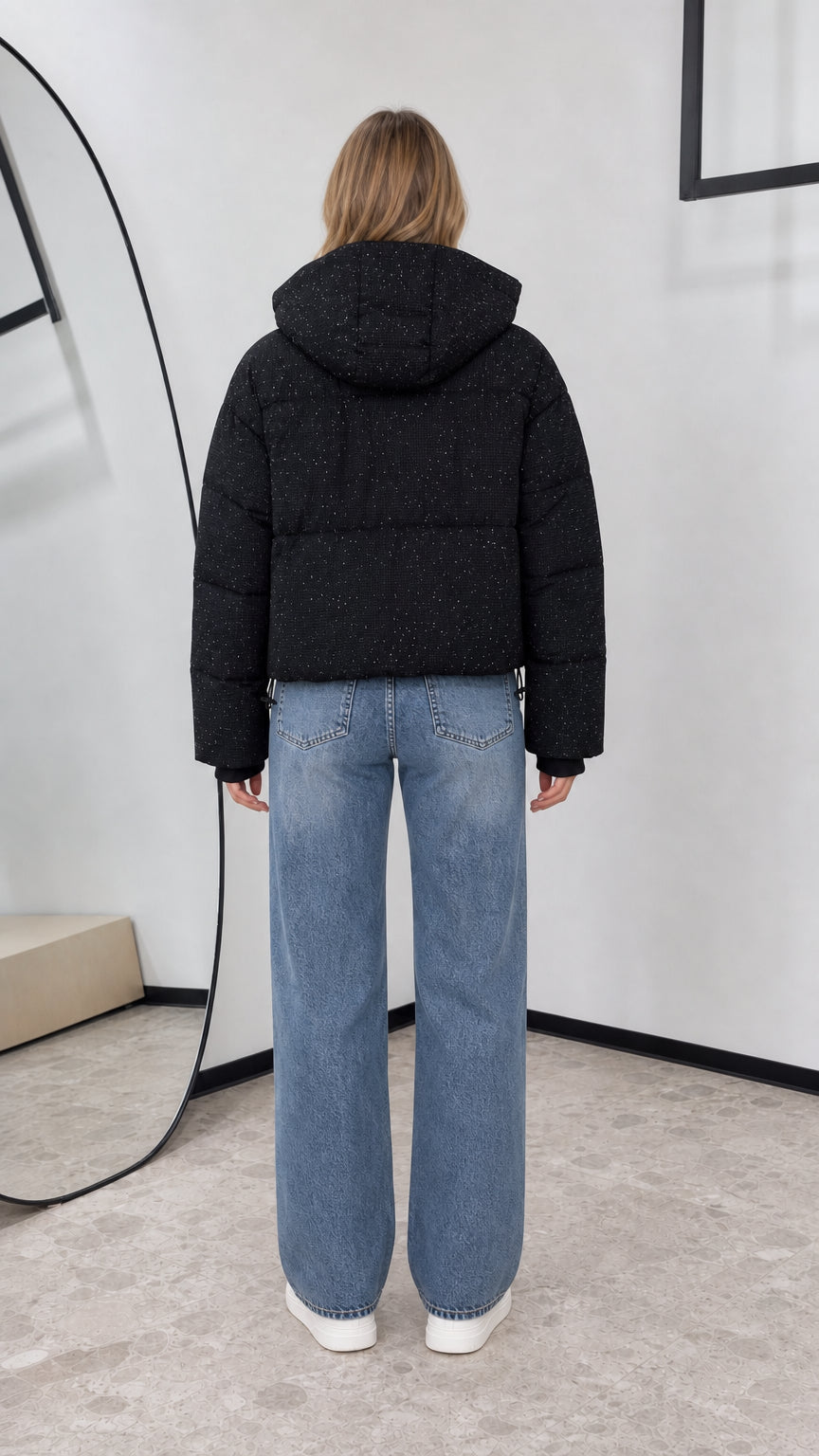 Back view of black hooded cropped puffer jacket