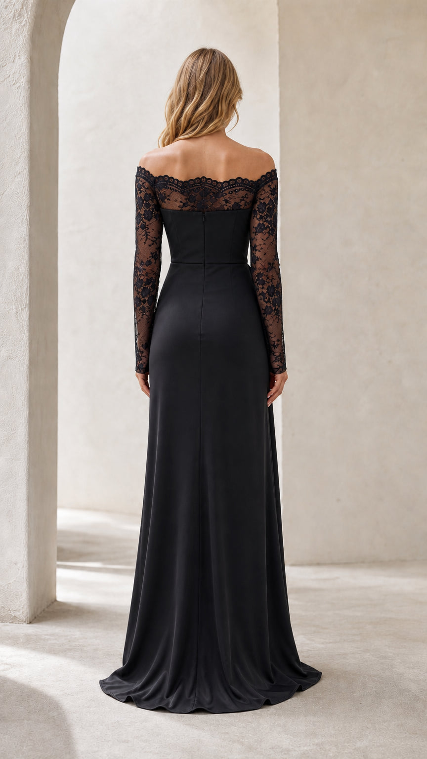 Back view of black long sleeve evening dress showing sheer lace upper and sweeping hem