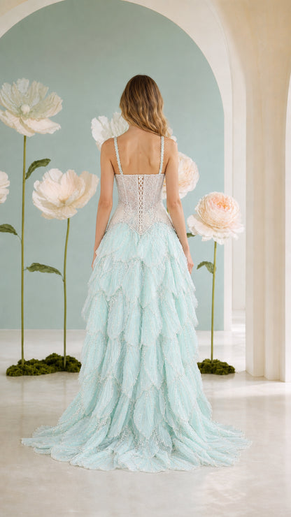 Back view of mint green corset evening gown with lace-up detail and train