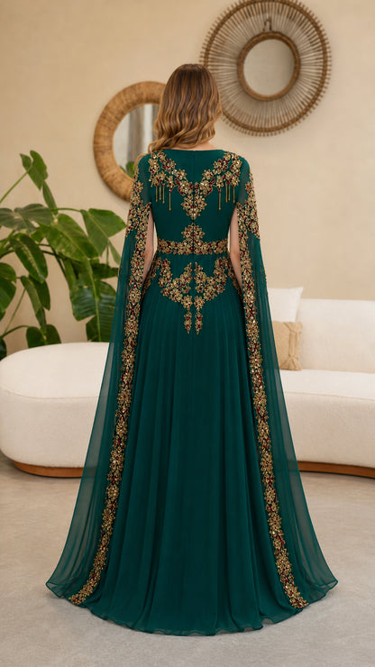 Back view of model showing embroidery details on Emerald Green cape gown