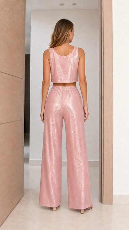 Back view of model in Dusty Pink sleeveless sequin top and trousers