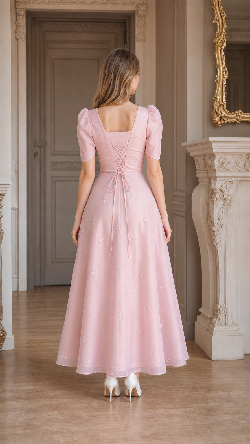 Back view of blush pink dress showing adjustable lace-up corset tie back
