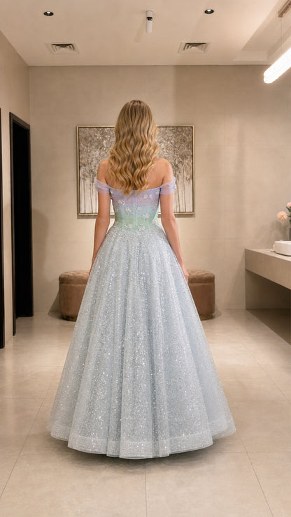 Back view of model wearing pastel ombre glitter tulle formal evening dress