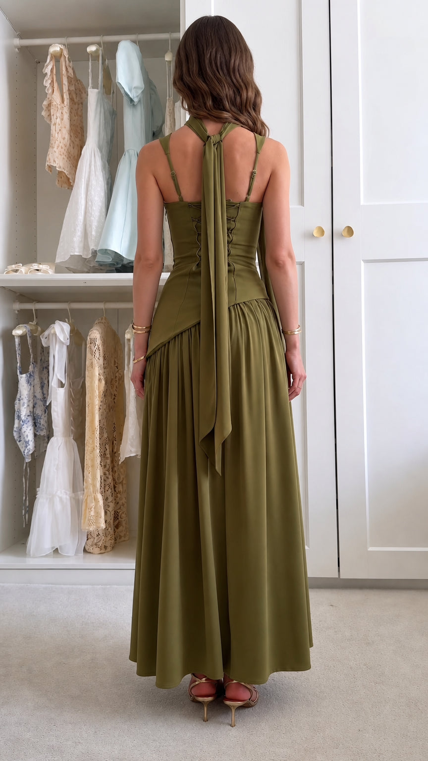 Back view of olive green corset maxi dress showing lace-up back and trailing scarf