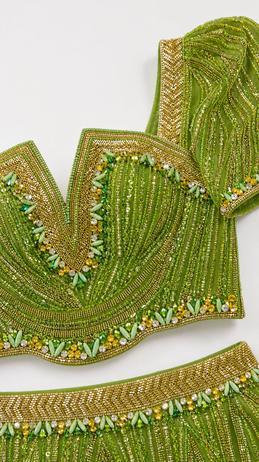 Close-up detail of ornate beaded sweetheart neckline and skirt trim