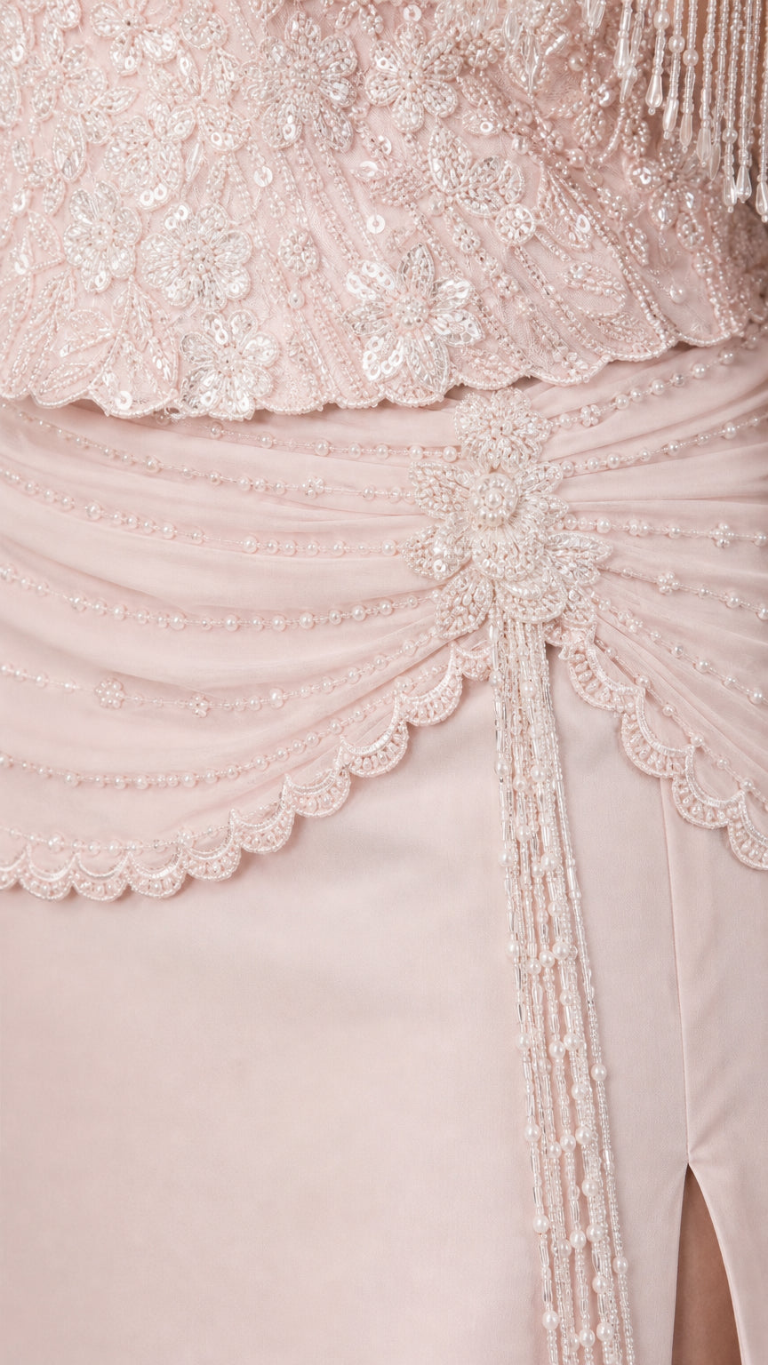 Close-up detail of ornate beadwork, fringe sleeves, and draped waist embellishment