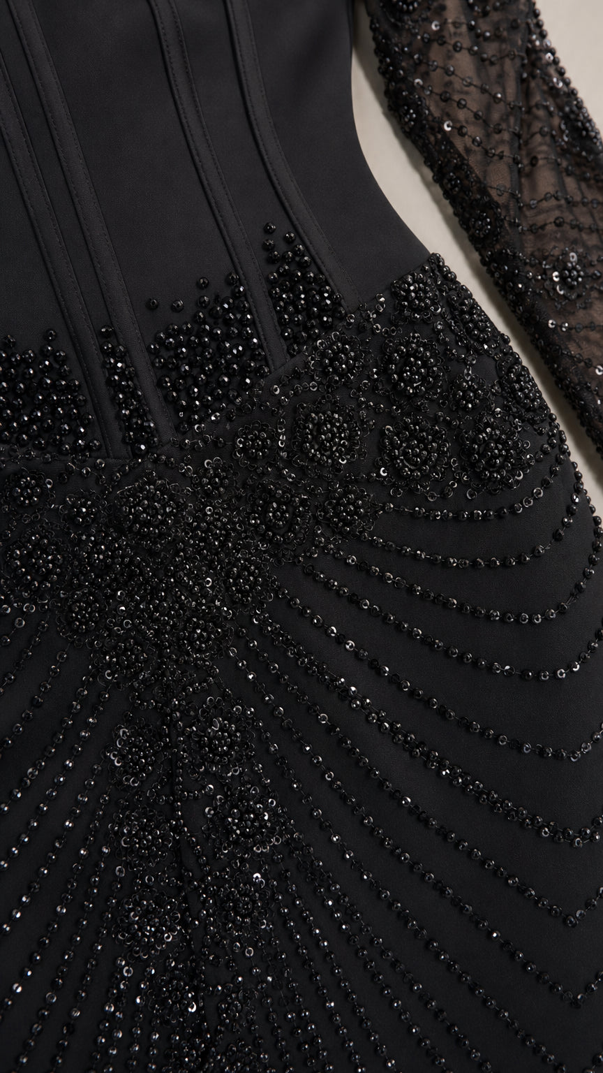 Close-up of black beaded pattern and structured bodice detailing