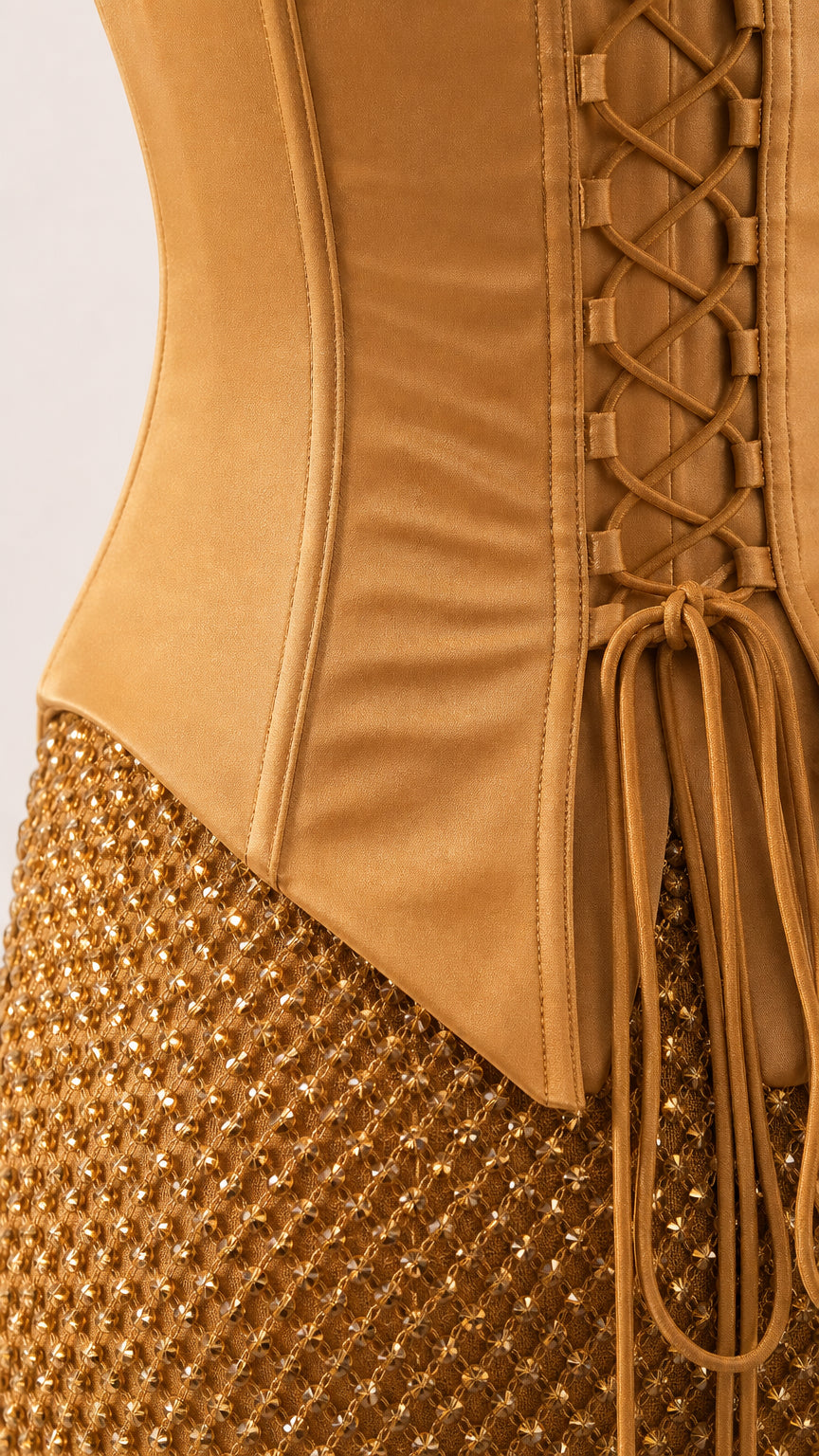Close-up detail of structured corset bodice, boning, and textured shimmer fabric