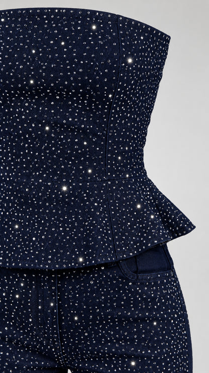 Close-up detail of rhinestone embellishments and peplum hem on Navy Blue top and pants