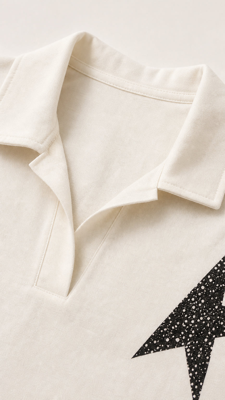 Close-up detail of the open notch collar and star graphic patch
