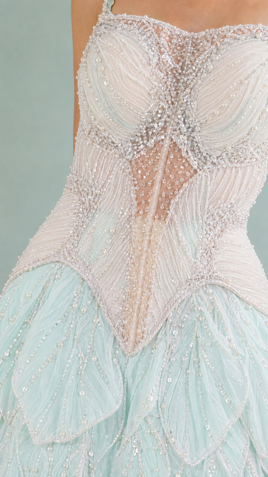 Close-up detail of beaded sheer corset bodice and sequined petal ruffles