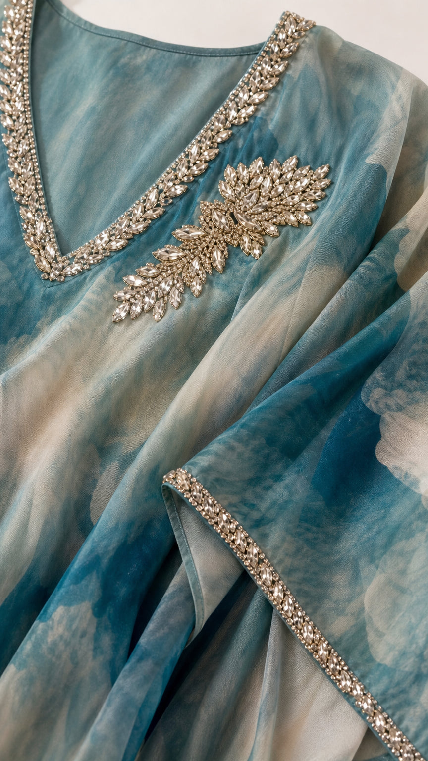 Close up of crystal rhinestone embellishments on V-neck and trim