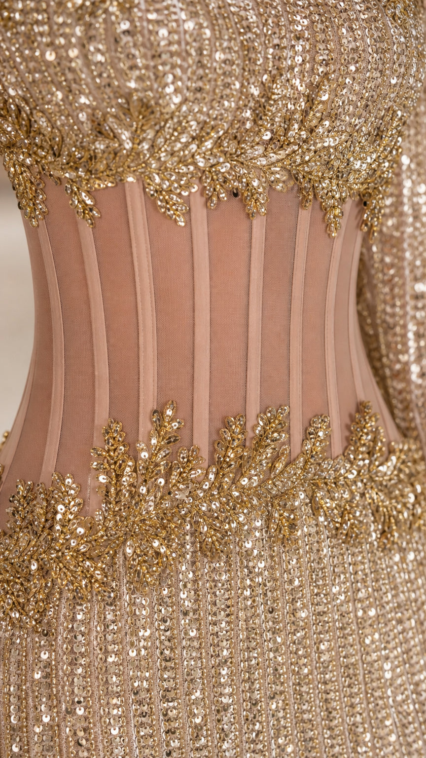 Close-up detail of illusion boned corset midriff with sequin applique embroidery