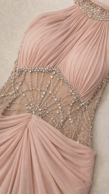 Close-up detail of sheer mesh waist panel with radiating rhinestone embellishments