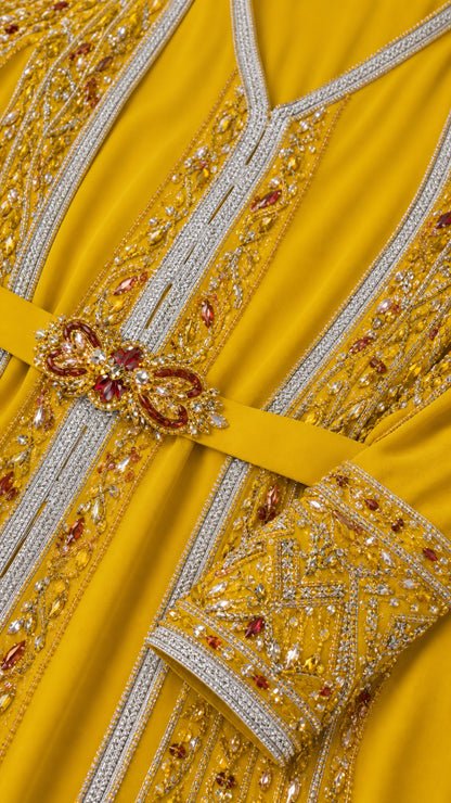 Close-up detail of intricate embroidery, beadwork, and jeweled belt on Mustard Yellow fabric