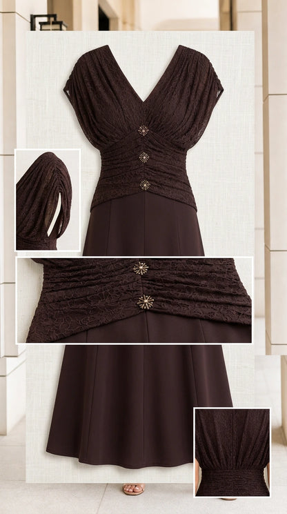 Detail flat-lay of chocolate brown dress showing ruched bodice and embellished crystal buttons