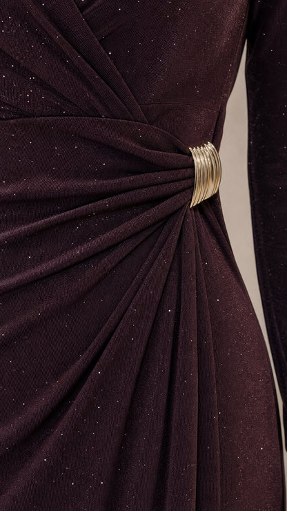 Close-up detail of side ruching and polished metallic clasp on deep plum shimmer fabric