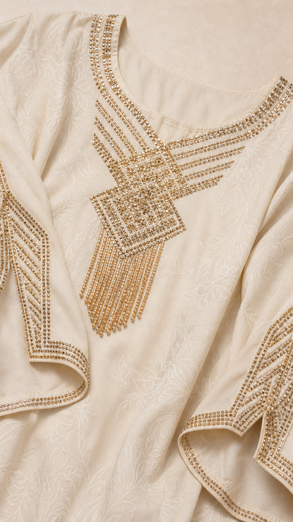 Close-up detail of Cream jacquard fabric with gold rhinestone and beaded embroidery